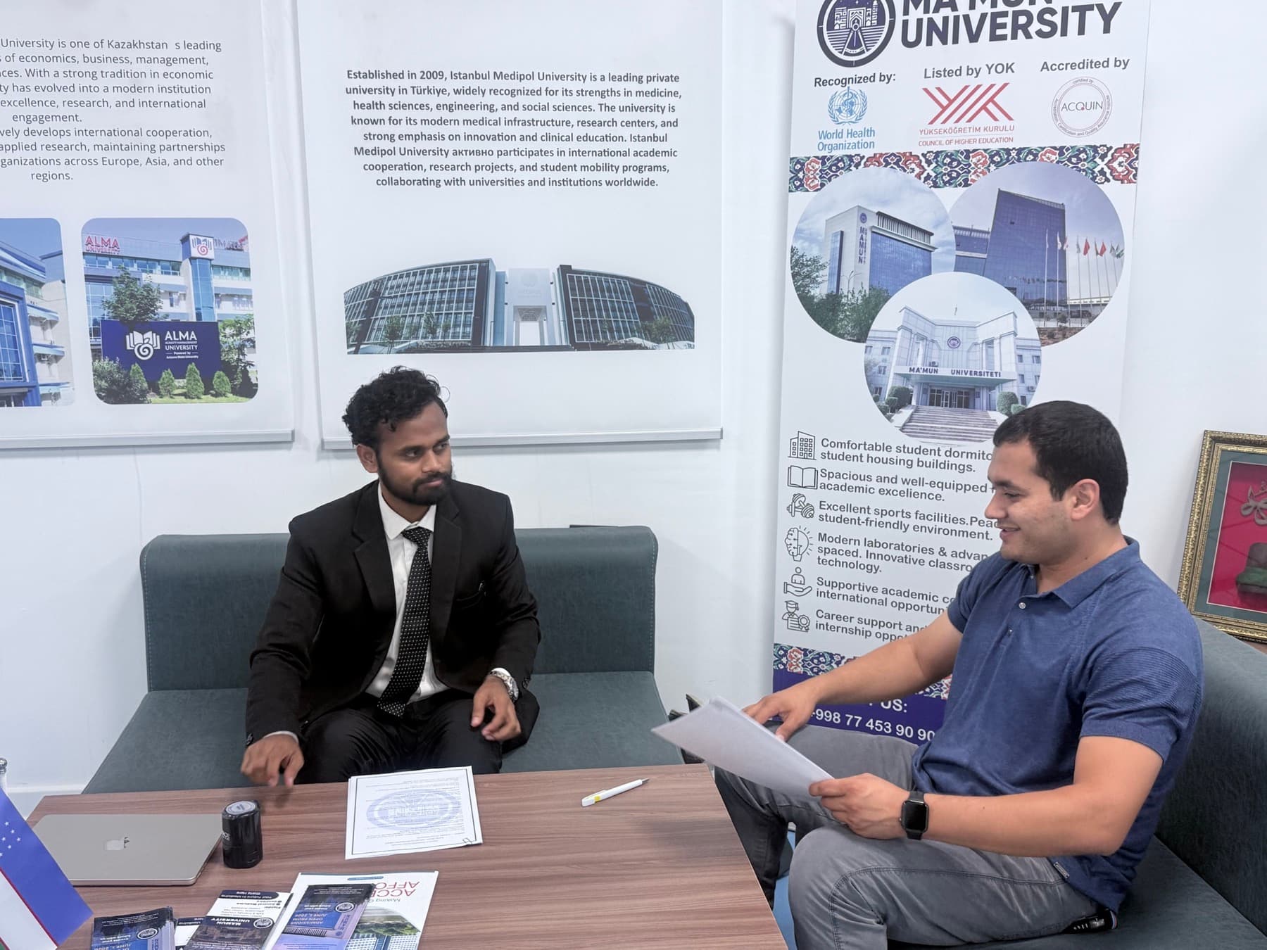 Dr. Ravi in an official partnership meeting with a Ma'mun University representative.