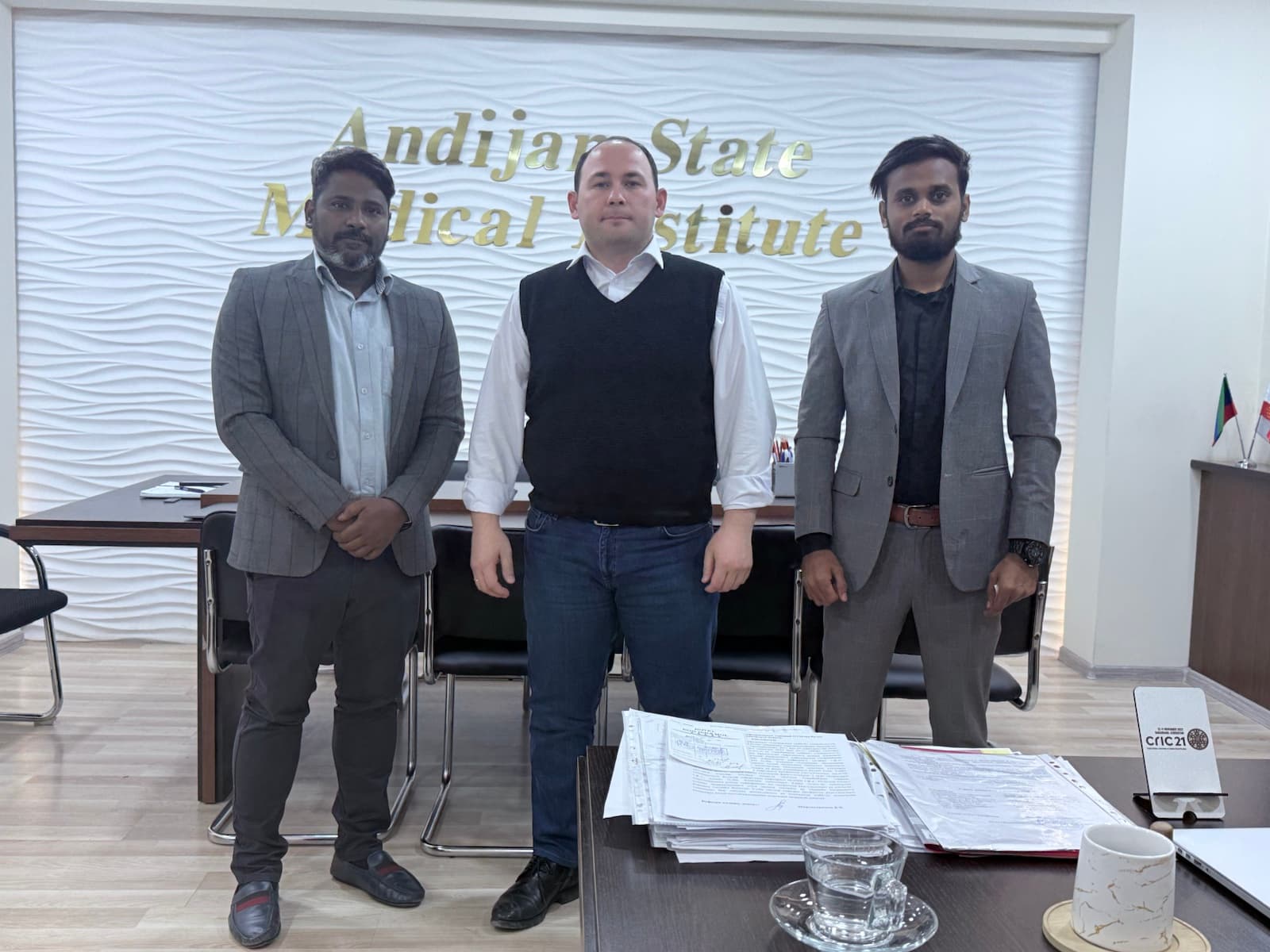 Dr. Ravi and a Blue Pen Education representative meeting an official at Andizhan State Medical Institute in Uzbekistan.