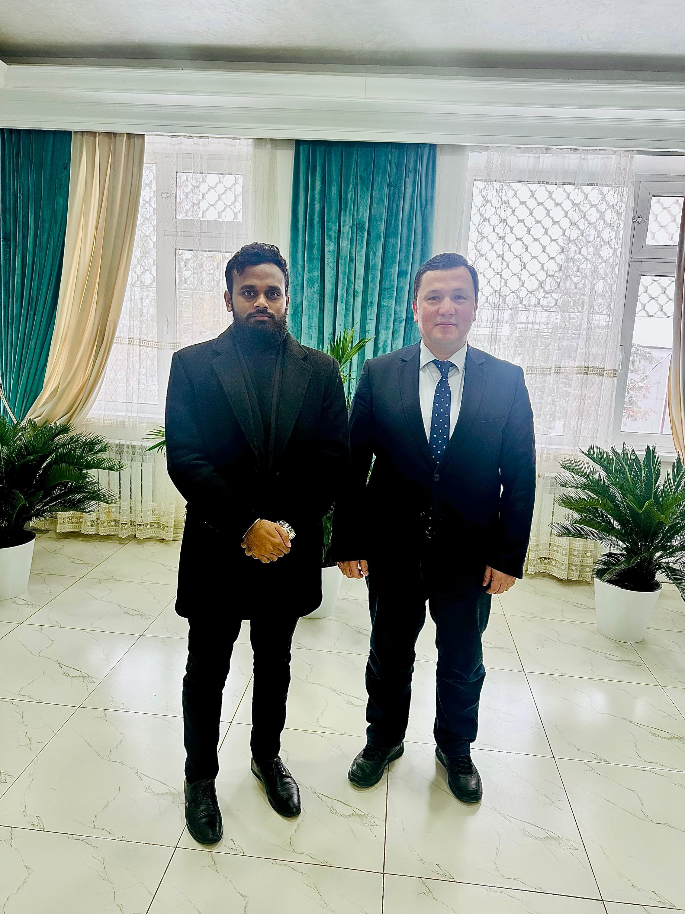 Dr. Ravi meeting Professor Mukhiddin Kalonov, Rector of Navoi State University, during his university visit in Navoi, Uzbekistan.